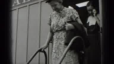 New York USA (1939): Two Women And A Man With Happy Expressions Getting Off Of A