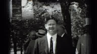 New York USA (1939): A Group Of Men Standing Around Outside Talking In Suits In A