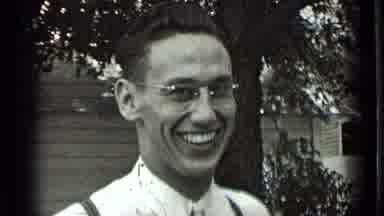 New York USA (1939): Young Man Chuckles And Shows His White Teeth Then Does A