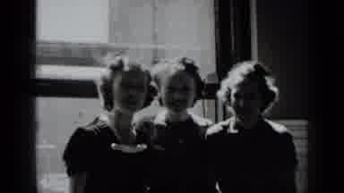 New York USA (1939): Group Of Three Young Girls Stand Together In A Building