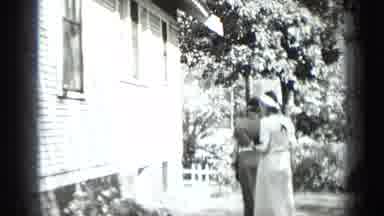NEW YORK USA-1939: Vintage Home Movie of Women Strolling Outside House on Sunny Summer Day