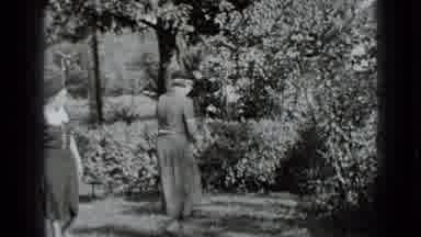 New York USA (1939): Women Greeting Each Other Outside In A Garden