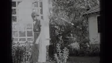 New York USA (1939): Lady In A Long Dress Walking Outside Her Home Then Sitting In