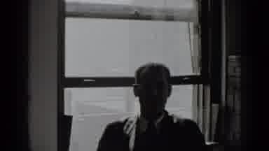 New York USA (1939): Man In A Sweater And Glasses Sits In Front Of The Window And