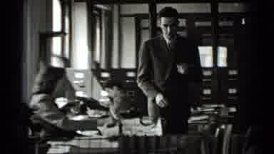 New York USA (1939): Two Men And 3 Women Working And Talking Office Reading Paper