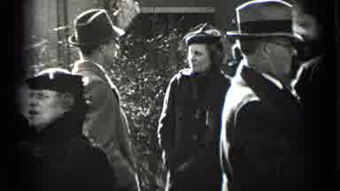 New York USA (1939): People Socialize On The Sidewalk And Street On A Day So Cold