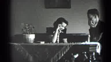 New York USA (1939): A Young Couple Plays Checkers At The Dining Room Table Next