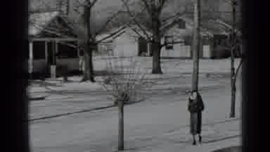 New York USA (1939): Black And White Video Shows A Woman Walking Down The Road In