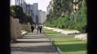 San Francisco California (1939): People Walking On A Sidewalk With Monuments And