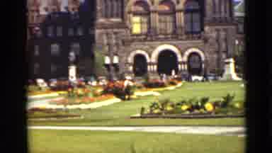 Ontario Canada (1940): Gardeners Watering A Field Of Flowers During The Day Time