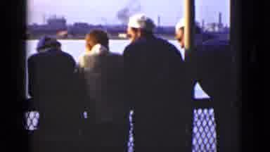 Ontario Canada (1940): Four Men Talking On A Bridge Above A River In A City