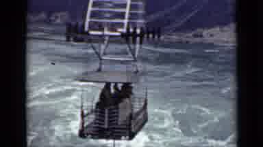 Ontario Canada (1940): A People Mover Carries People Over A Swirling Body Of Water