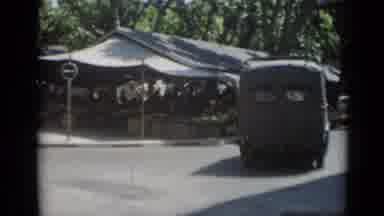 Cannes France (1962): Van Turning Right Onto Street Lined With Marketplace Tents