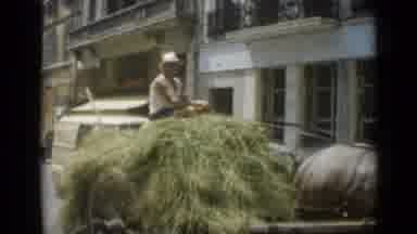 Cannes France (1962): Man Rides Horse Drawn Cart Full Of Hay Down Street Cuts To