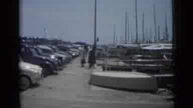 Cannes France (1962): People Enjoy The Day Ad The Beach Or On The Docks And A