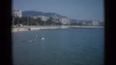 Cannes France (1962): Large Corridor Is Shown Before Viewing Many People Swimming