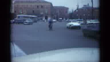 Cannes France (1962): Traffic Including A Motorcycle Bicycle And A White Car Drive