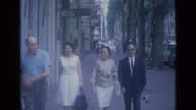 Cannes France (1962): Two Men And Women Walk Towards The Camera And Smile At It