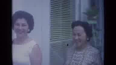 Cannes France (1962): Two Smiling Women And A Man Walking Down The Busy Street
