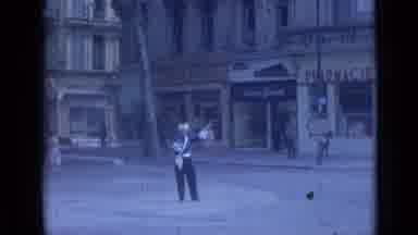 Cannes France (1962): Man Dressed In Blue Directs Traffic Yellow Truck Drives By