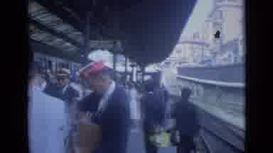 Cannes France (1962): A Lot Of People Standing At A Train Station Watching As A