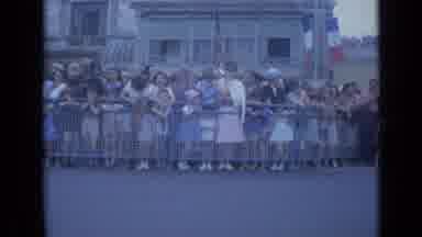 Cannes France (1962): The Crowd Lines Up Behind The Gate Waiting For The Parade To