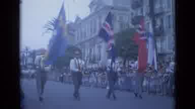 Cannes France (1962): People Marching With Flags In A Parade On The Street