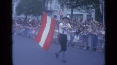 Cannes France (1962): People Walking Down The Street Holding A Flag And Signs In A