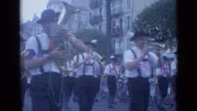 Cannes France (1962): A European Band In Suspenders Marches And Plays In A Parade