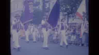 Cannes France (1962): People Marching In A Parade Wearing Suits