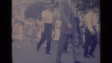 Cannes France (1962): A Procession Of Men And Women Are Walking On Street Crowded