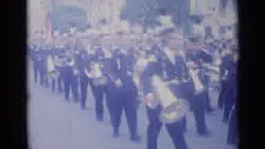 Cannes France (1962): Marching Band Makes Its Way Through The Town Parade Smiling