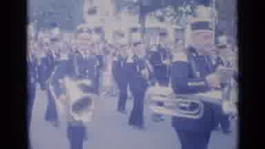Cannes France (1962): A Tuba Player In The Marching Band Waves To The Camera As A