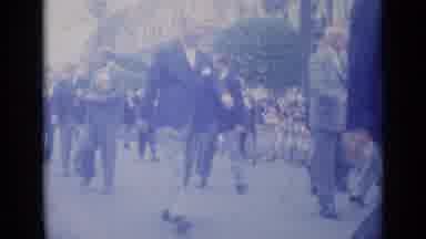 Cannes France (1962): Citizens Watch Celebration Parade Marching Down The Street