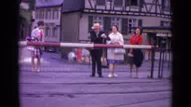 Germany (1962): Men And Women Waiting To See The Train Come Through So They Can
