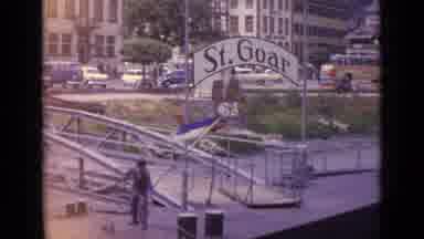Germany (1962): A Man Standing On A Floating Boat Dock Pulls On A Rope On A Windy