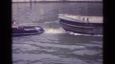 Germany (1962): Small Boat Pulls Big Boat In River Boat Is Empty In Day Time