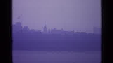 London England-1962: Foggy Buildings Near A Tall Castle Looking Tower With A