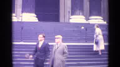 London England (1962): People Walking On The Stone Steps On A Large Building