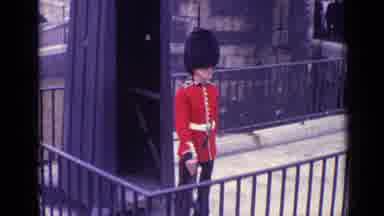 London England (1962): A British Soldier Standing Still Watching The Street Around