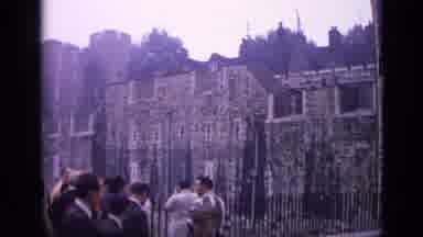 London England (1962): Lots Of People Flock Towards Long And Ancient Castle Walls