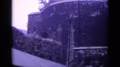 London England (1962): Black Old Brick Castle With Glass Windows And Cloudy Sky