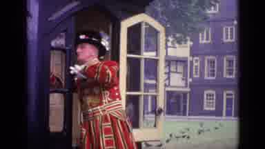 London England (1962): Gentleman In Red Is Walking Across Street In Nice Outfit