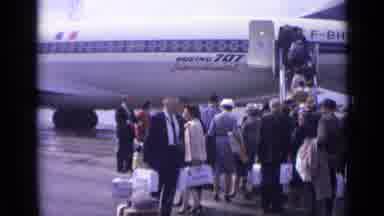 London England (1962): Woman In Yellow Coat Waiting In Line On Airport Runway To