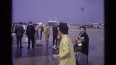 London England (1962): Passengers Waiting In Line On The Tarmac Of A Airport