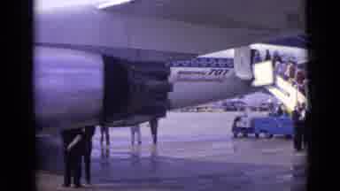 London England (1962): People Getting On An Airplane Standing In Line On Stairs To