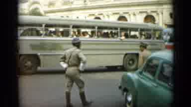 Monaco City (1962): Officer In Uniform Guarding A Bus While A Woman Walks By A Man