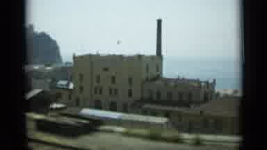 Monaco City (1962): View From A Car Driving Down A Highway Looking Down At A City