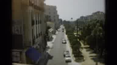 Monaco City (1962): Camera Pan Of City In Tropical Area With Cityscape Trees And