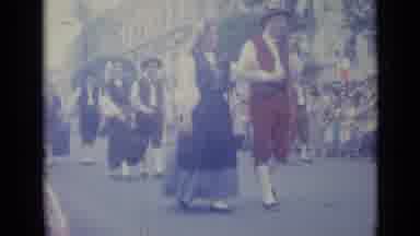 Nice France (1962): Couples Happily Parade Down City Street While Spectators Watch